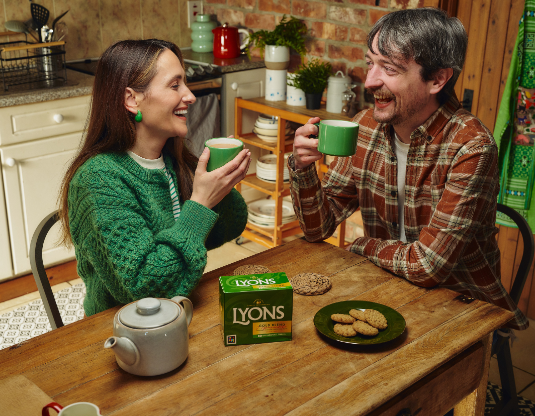 Two people drinking Lyons tea